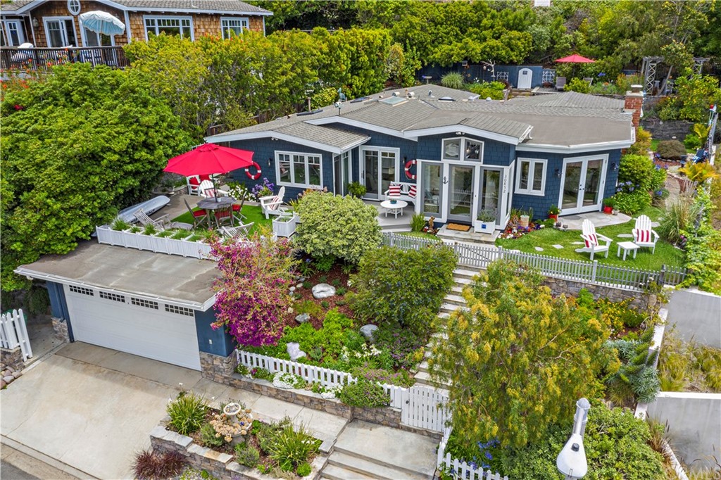 30852 Driftwood Drive Laguna Beach, CA 92651 - Photo 51 of 54 a front view of a house with a yard and fountain