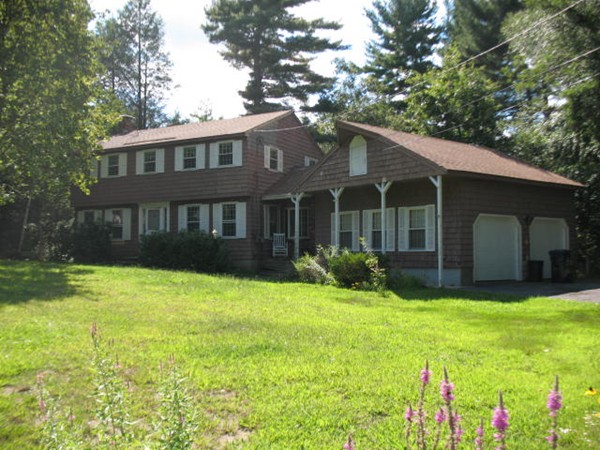 33 Douglas Road Dracut, MA 01826 - Photo 2 of 25 a view of a house with a yard and plants