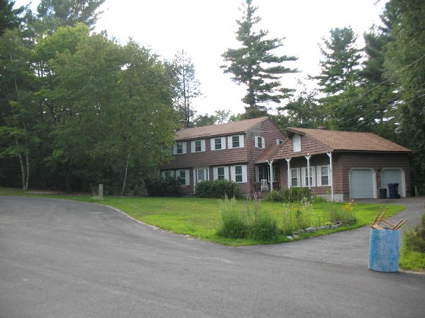 33 Douglas Road Dracut, MA 01826 - Photo 21 of 25 a view of a house with a garden and pathway