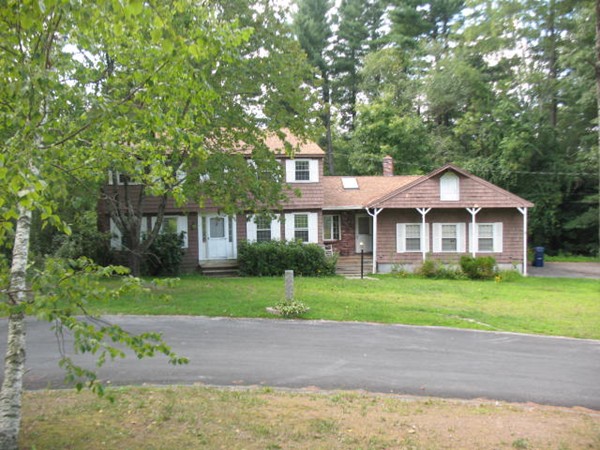 33 Douglas Road Dracut, MA 01826 - Photo 23 of 25 a front view of a house with a garden