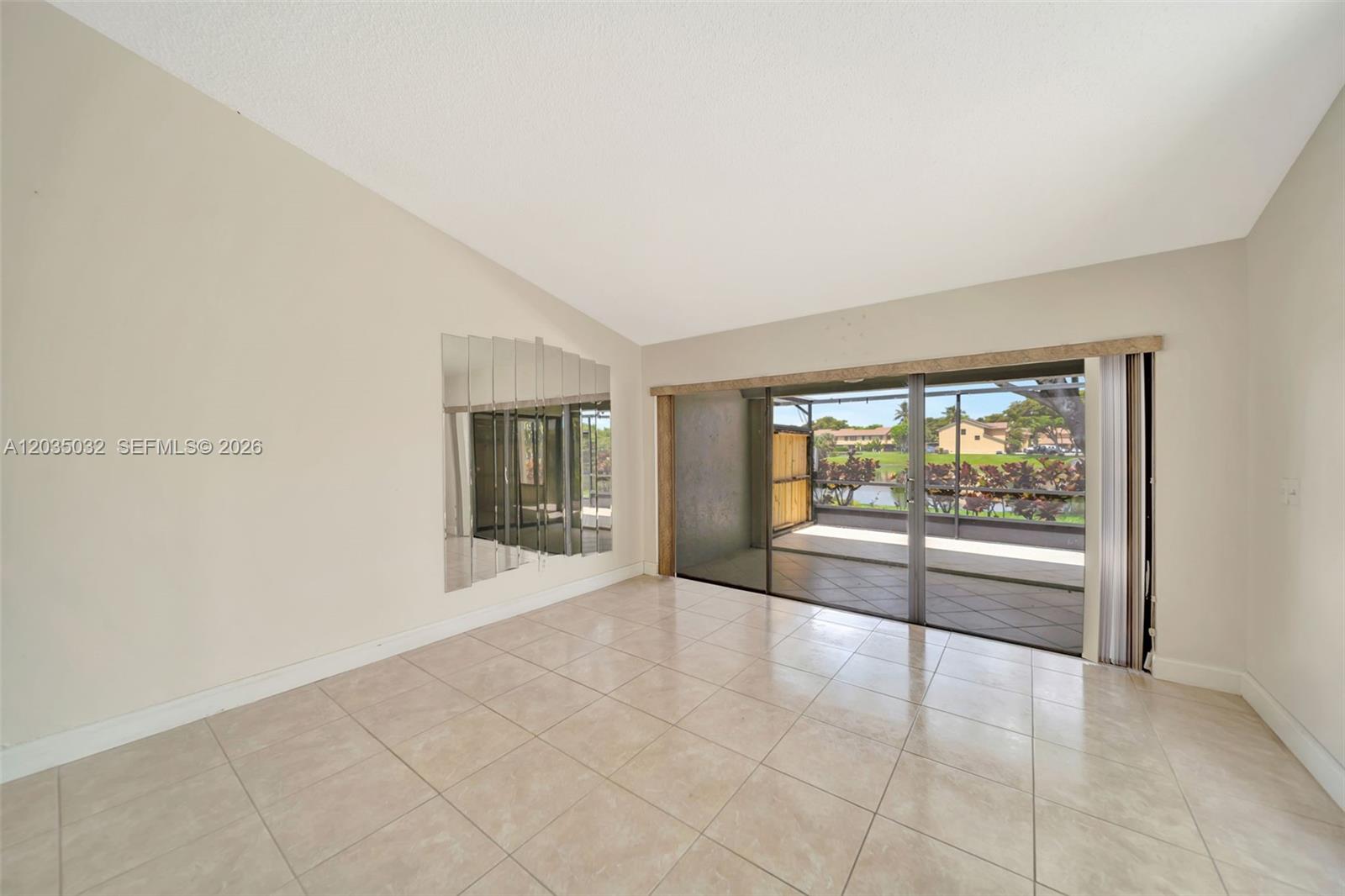 5223 Gate Lake Road, Unit 5223 Tamarac, FL 33319 - Photo 18 of 37 a big room with wooden floor and windows