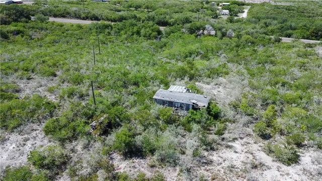 a aerial view of a house with a yard