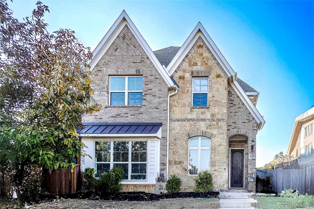a front view of a house with yard