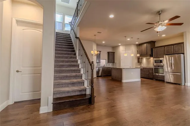a view of kitchen with cabinets and wooden floor
