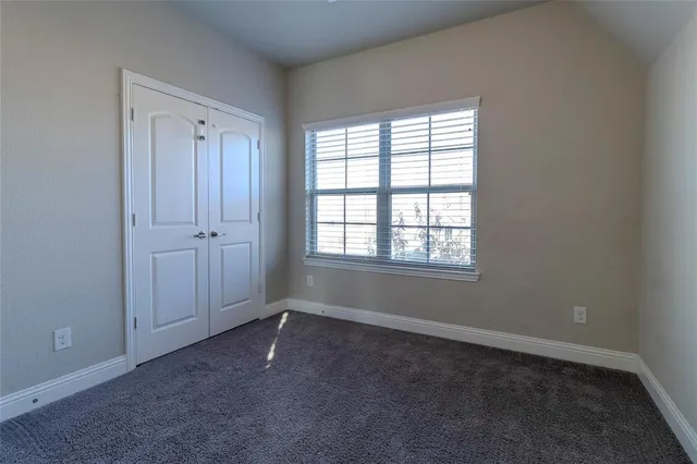 a view of room with window and closet