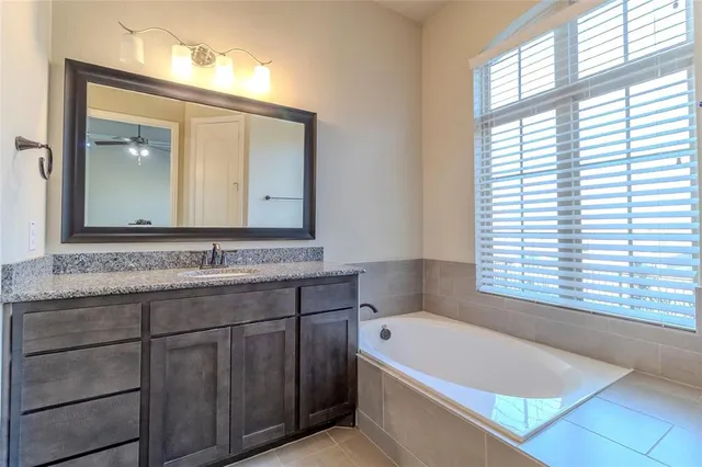 a bathroom with a bathtub and a sink