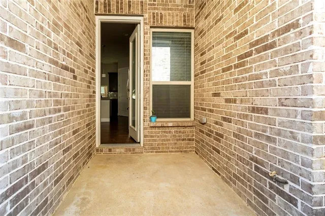 a view of a brick house with an empty space