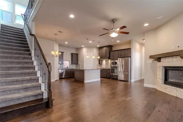 a view of kitchen with furniture and wooden floor