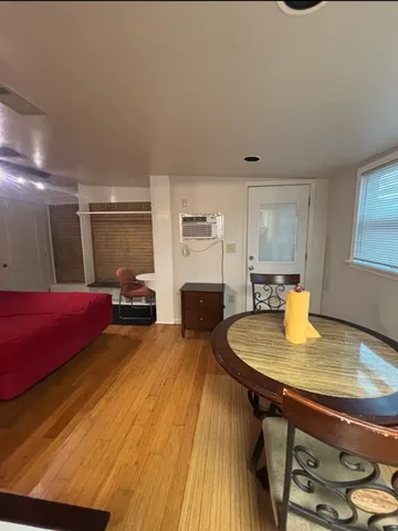 a swimming pool with a table and chairs