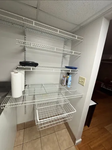 a view of entryway and kitchen