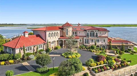 an aerial view of multiple houses with yard