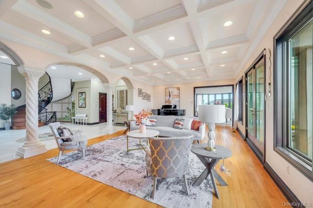 a kitchen with stainless steel appliances kitchen island granite countertop a stove and cabinets