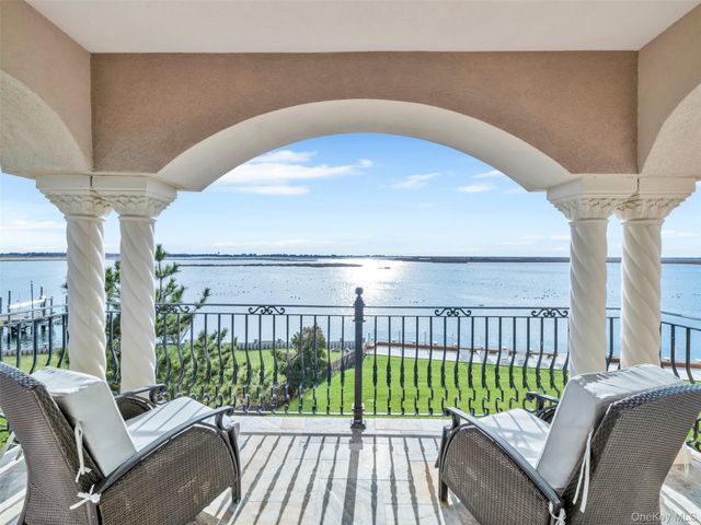 a spacious bedroom with a large bed and a dresser