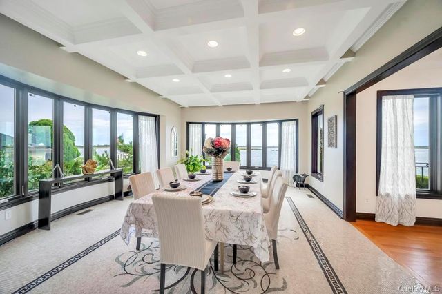 a bedroom with a large bed and a large window