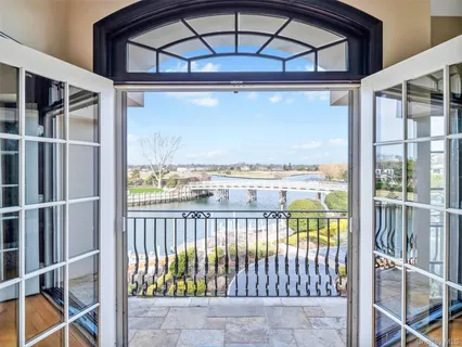 a dining room with furniture a chandelier and fireplace