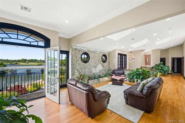 a spacious bedroom with a large bed and a large window