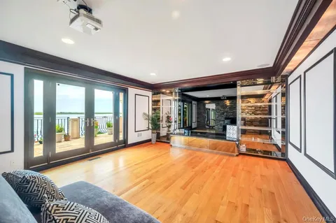 a view of hallway with furniture and a fireplace