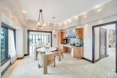 a very nice looking room with a large window and dining table