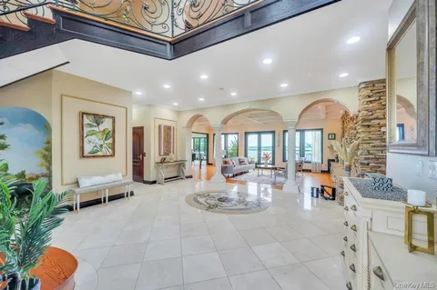 a living room with furniture windows and a fireplace
