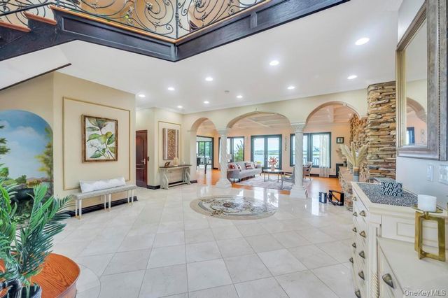 a living room with furniture windows and a fireplace
