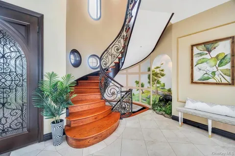 a bedroom with a large bed and a balcony