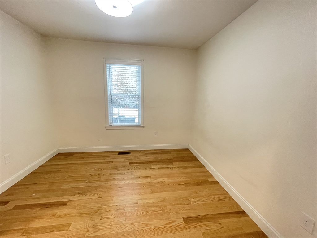 95 Phillips Street, Unit 1 Methuen, MA 01844 - Photo 2 of 10 a view of an empty room and window