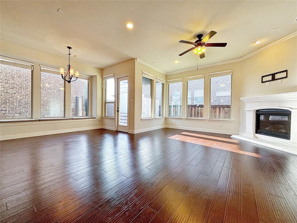 3037 Crestwater Ridge Keller, TX 76248 - Photo 7 of 25 a view of an empty room with wooden floor and a window