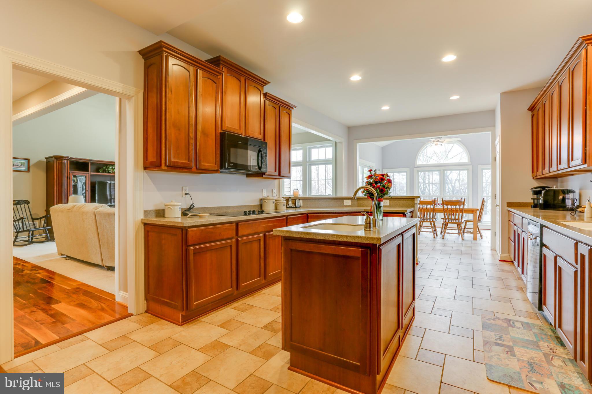 8490 Mapleville Road Mount Airy, MD 21771 - Photo 12 of 30 a kitchen with stainless steel appliances granite countertop a sink and cabinets