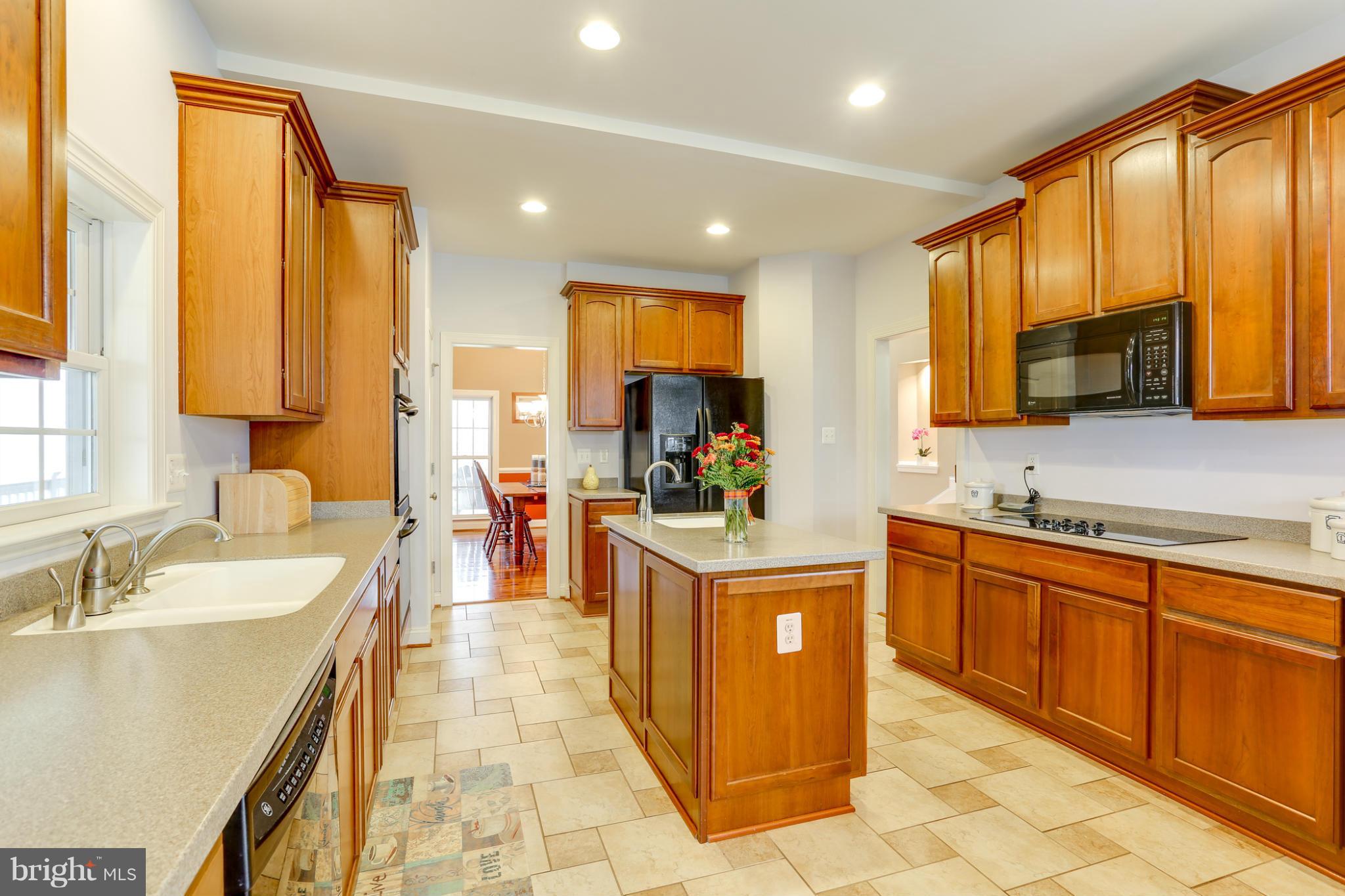 8490 Mapleville Road Mount Airy, MD 21771 - Photo 14 of 30 a large kitchen with stainless steel appliances lots of counter space and a sink