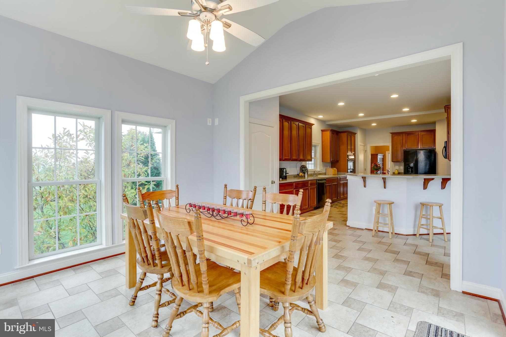 8490 Mapleville Road Mount Airy, MD 21771 - Photo 16 of 30 a view of a dining room with furniture window and outside view