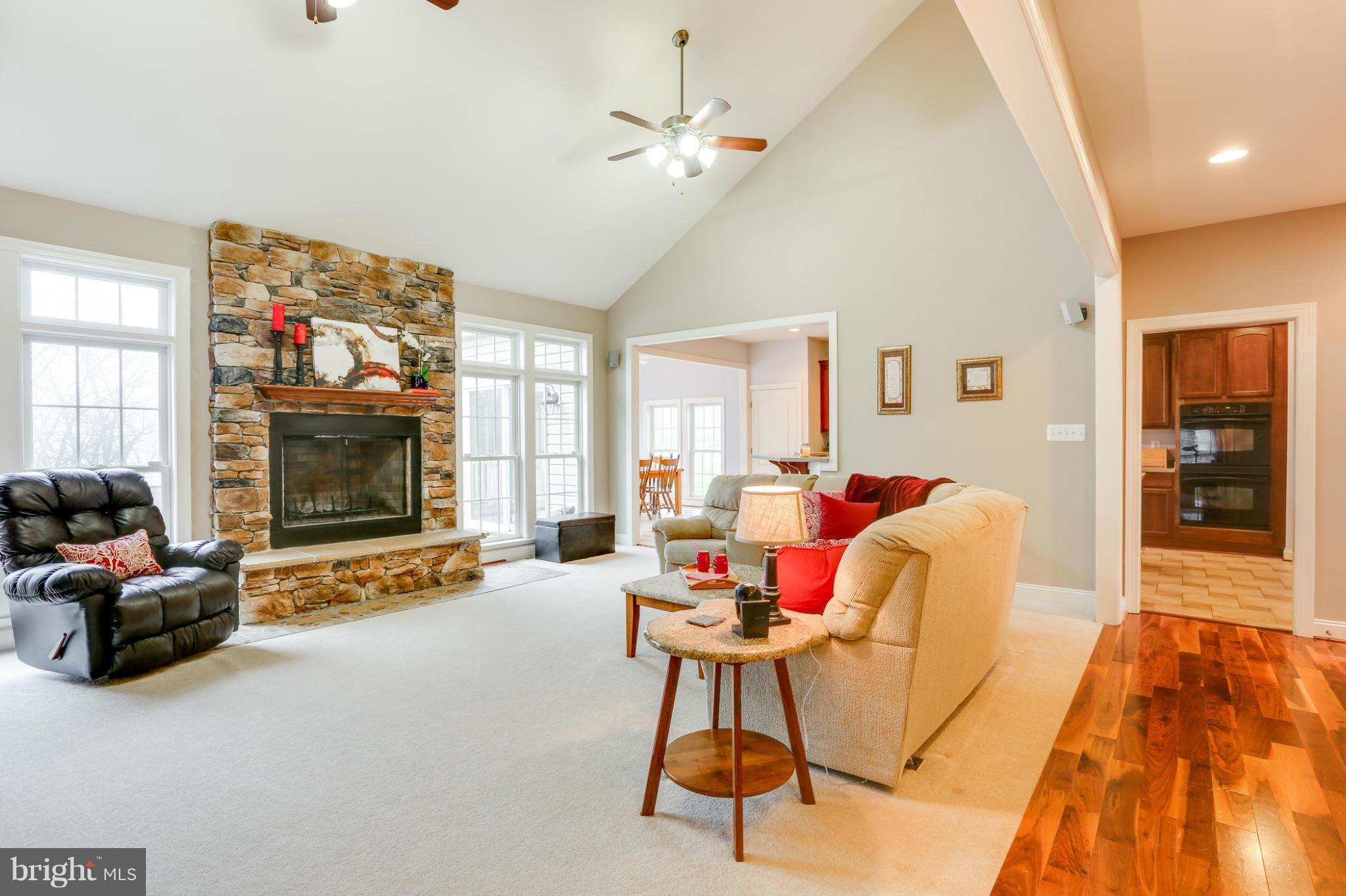 8490 Mapleville Road Mount Airy, MD 21771 - Photo 18 of 30 a living room with furniture and a flat screen tv