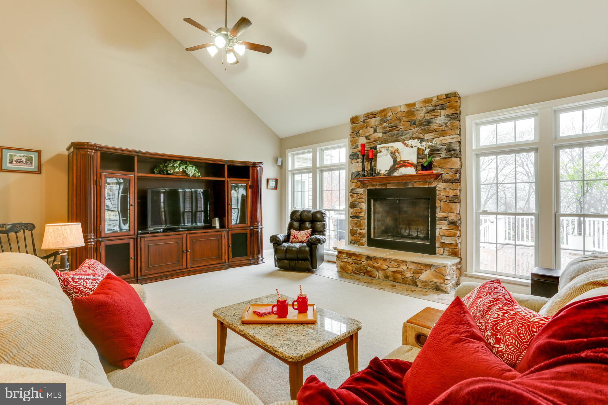 8490 Mapleville Road Mount Airy, MD 21771 - Photo 19 of 30 a living room with furniture and a flat screen tv