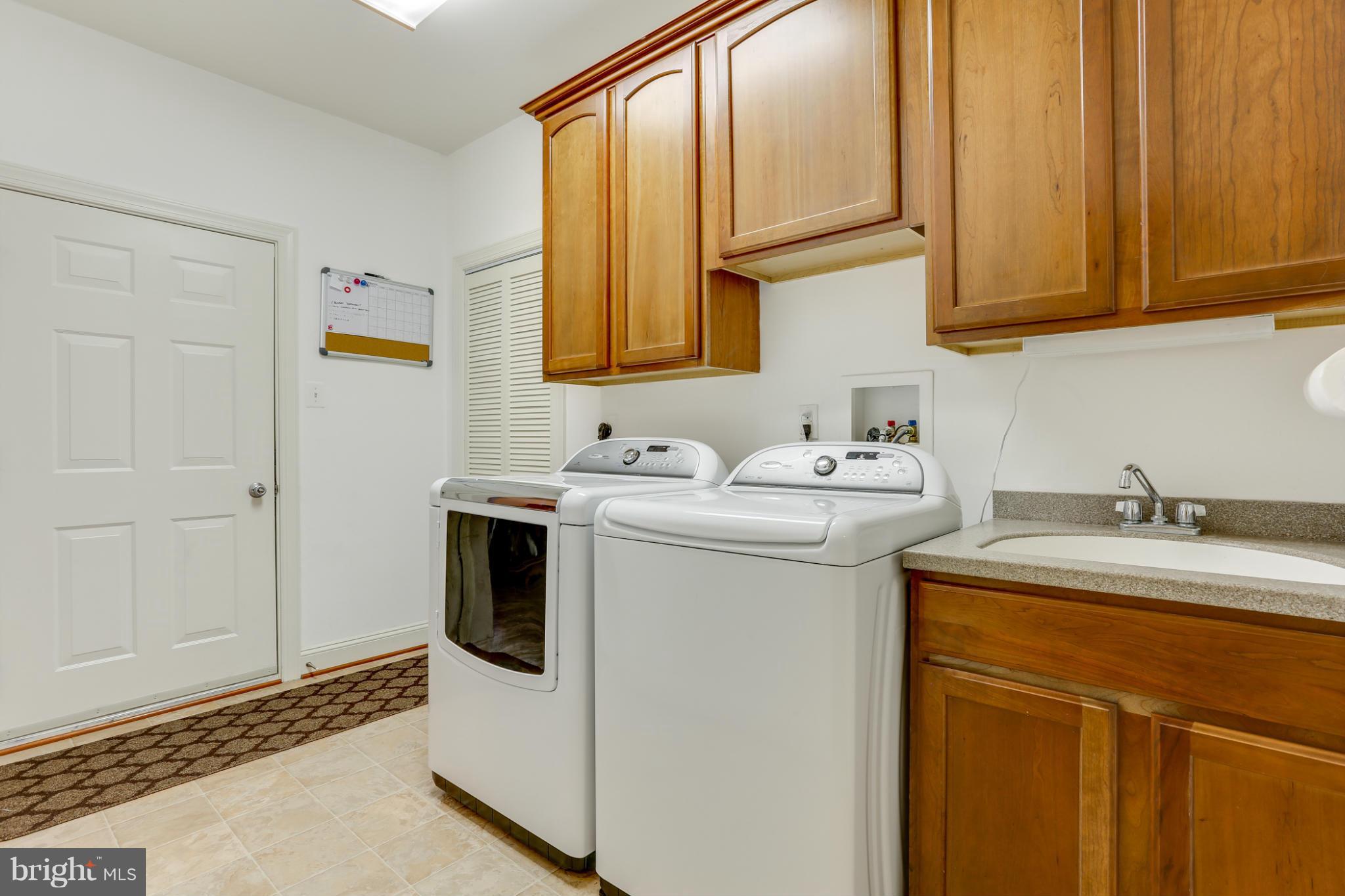 8490 Mapleville Road Mount Airy, MD 21771 - Photo 20 of 30 a utility room with sink dryer and washer