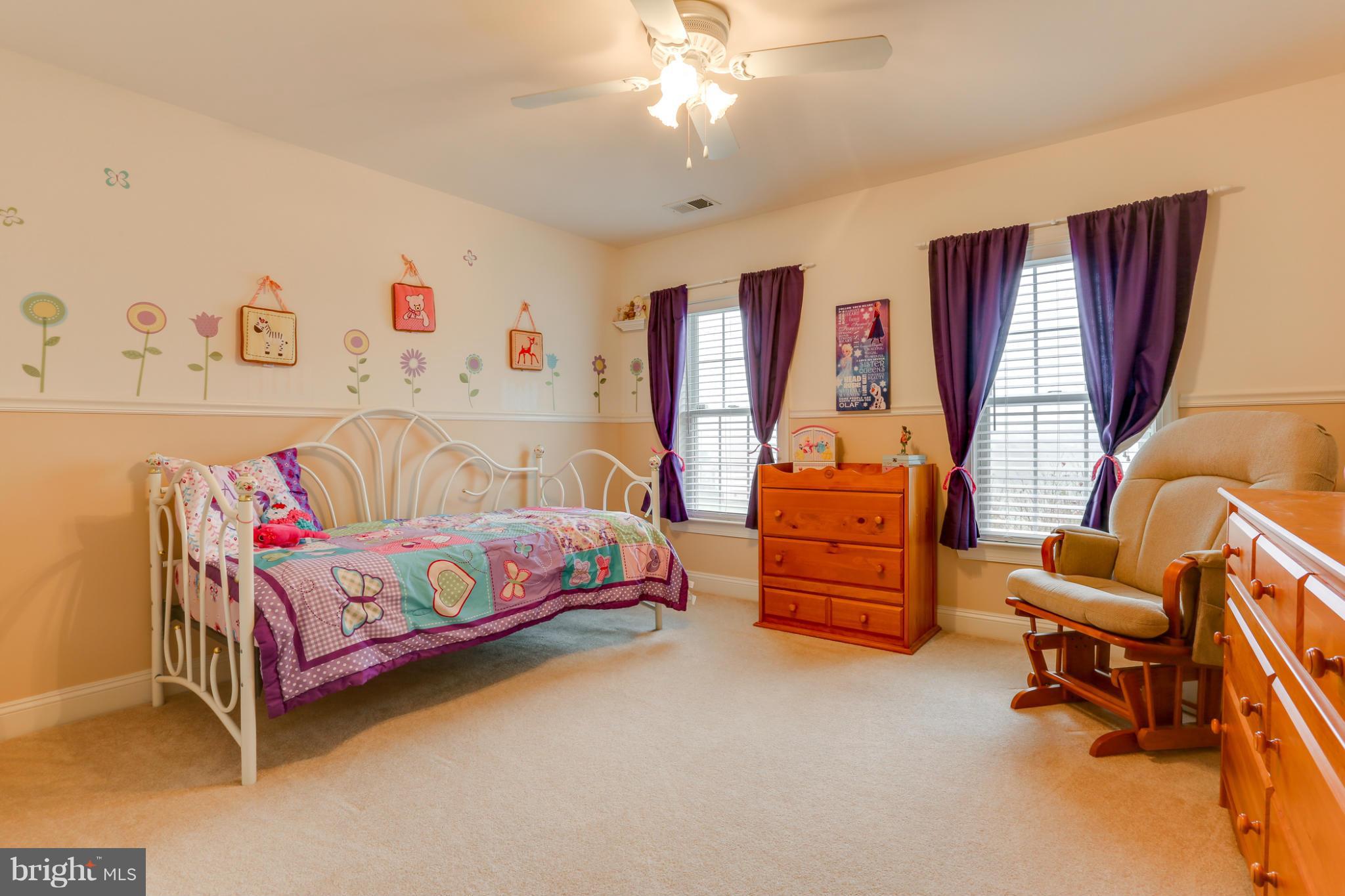 8490 Mapleville Road Mount Airy, MD 21771 - Photo 27 of 30 a bedroom with a bed and a couch