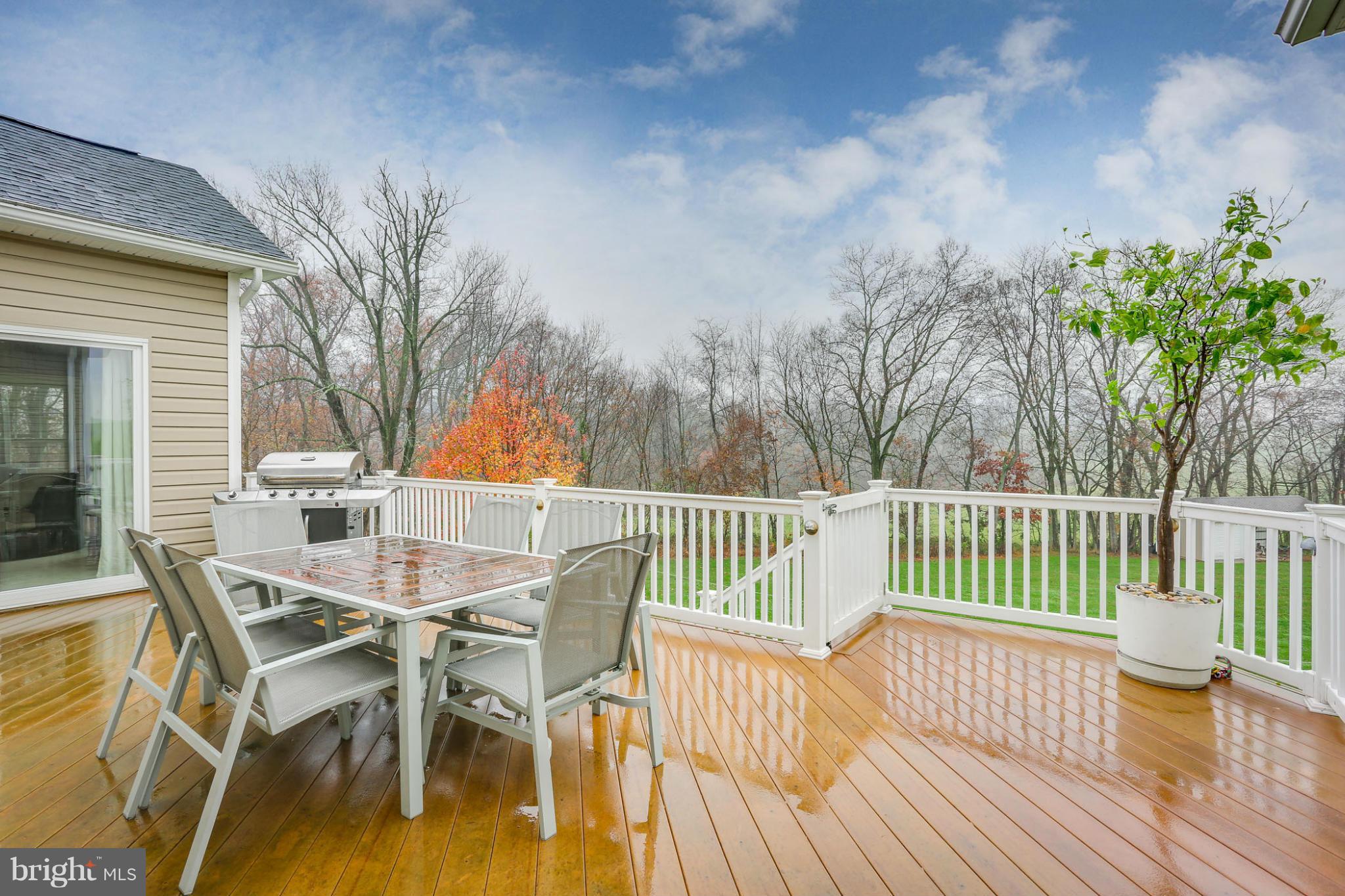 8490 Mapleville Road Mount Airy, MD 21771 - Photo 7 of 30 a view of a chair and table on the wooden floor