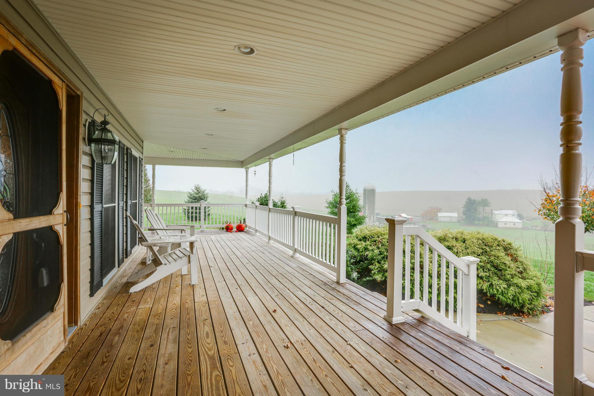 8490 Mapleville Road Mount Airy, MD 21771 - Photo 8 of 30 a view of a patio with wooden floor