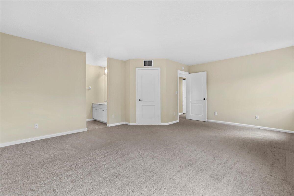 41 Uno Lago Drive Juno Beach, FL 33408 - Photo 14 of 31 a view of an empty room
