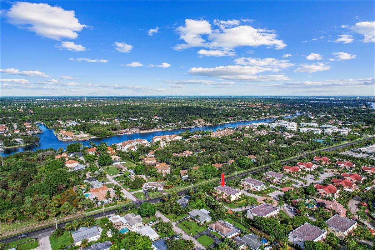 41 Uno Lago Drive Juno Beach, FL 33408 - Photo 25 of 31 an aerial view of residential houses with outdoor space