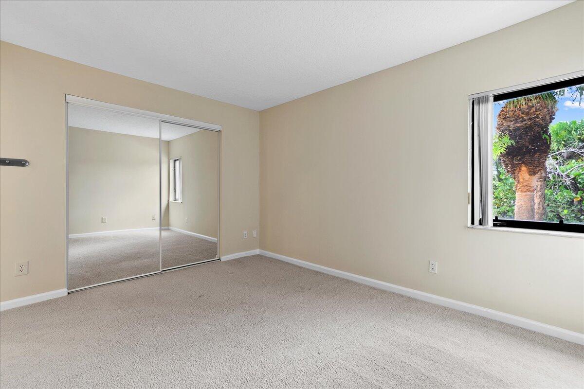 41 Uno Lago Drive Juno Beach, FL 33408 - Photo 10 of 31 a view of an empty room with a window