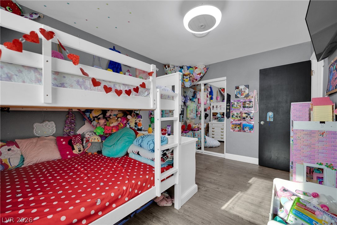 2221 Englestad Street North Las Vegas, NV 89030 - Photo 22 of 32 A well-lit bedroom creating a versatile and space-efficient living arrangement.