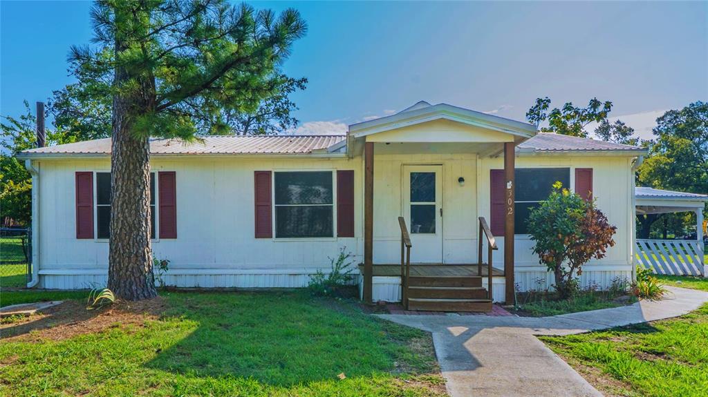 a view of a house with a small garden