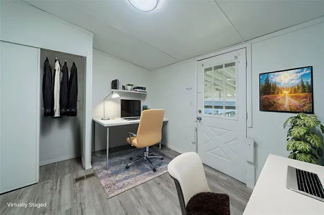 a workspace with furniture and wooden floor