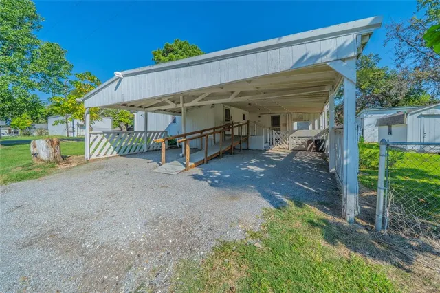 a view of a house with porch and furniture