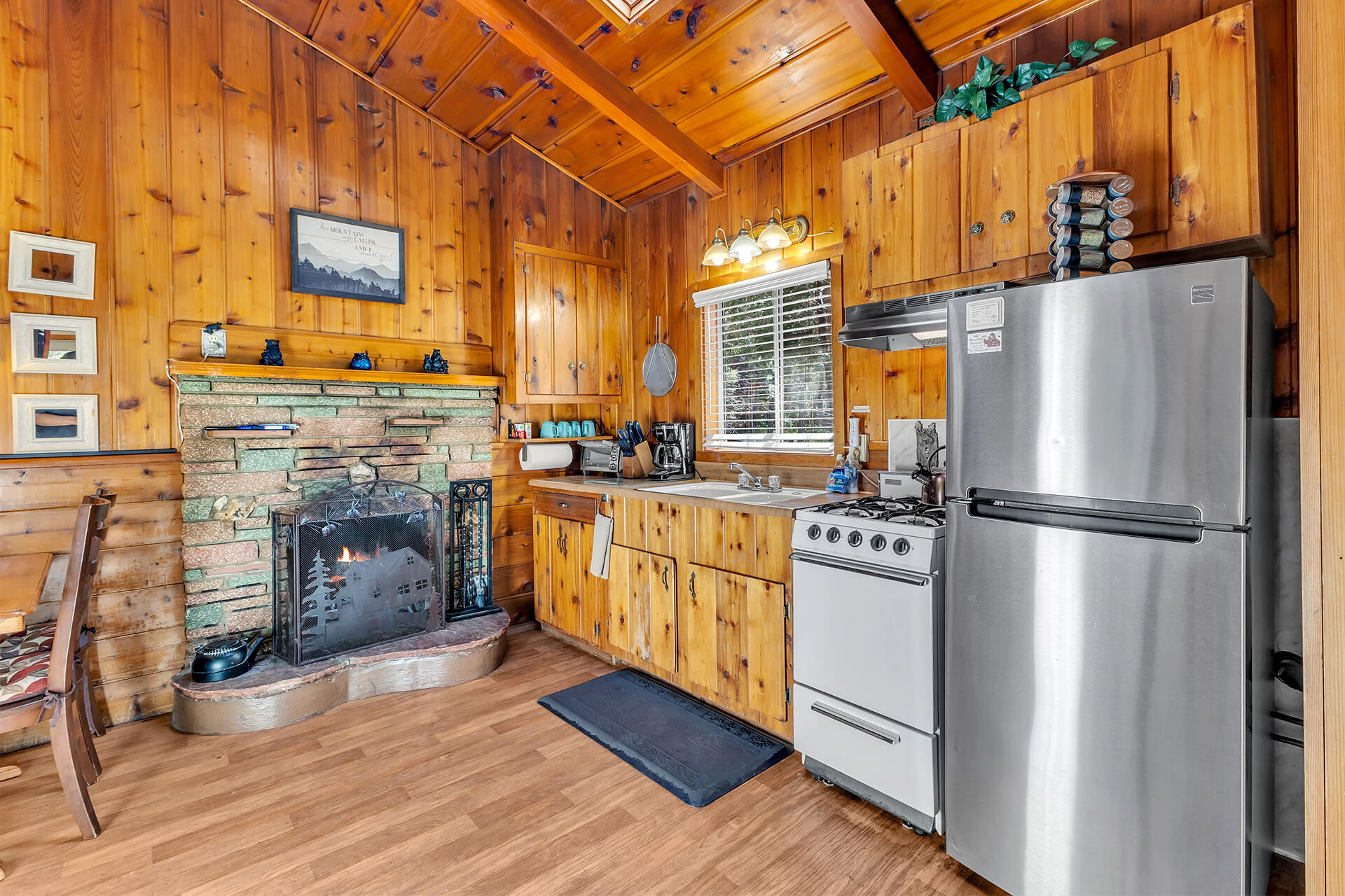 53460 Tollgate Road Idyllwild, CA 92549 - Photo 12 of 37 a kitchen with stainless steel appliances a refrigerator a stove a sink and dishwasher
