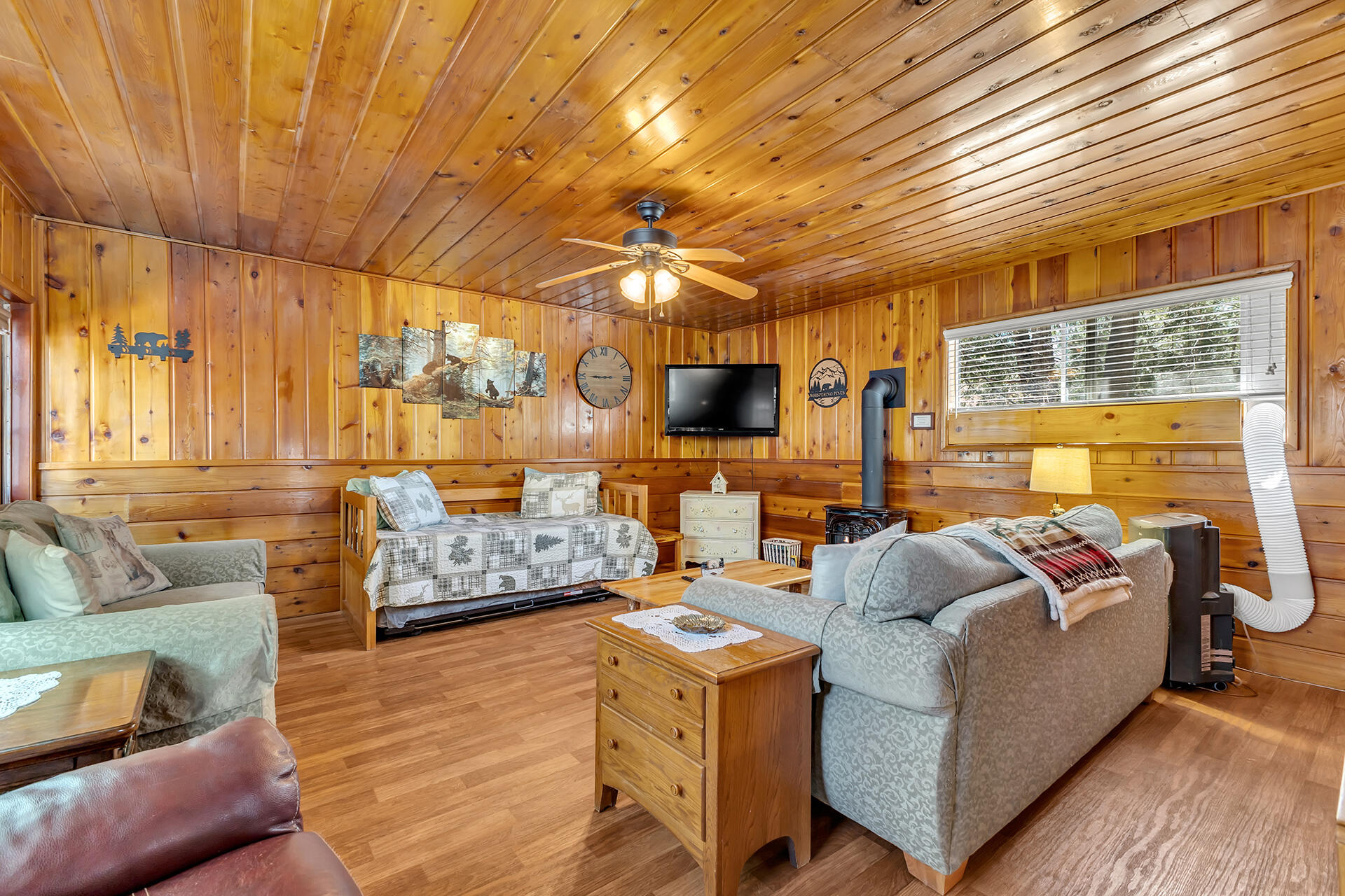 53460 Tollgate Road Idyllwild, CA 92549 - Photo 16 of 37 a living room with furniture a flat screen tv and a table