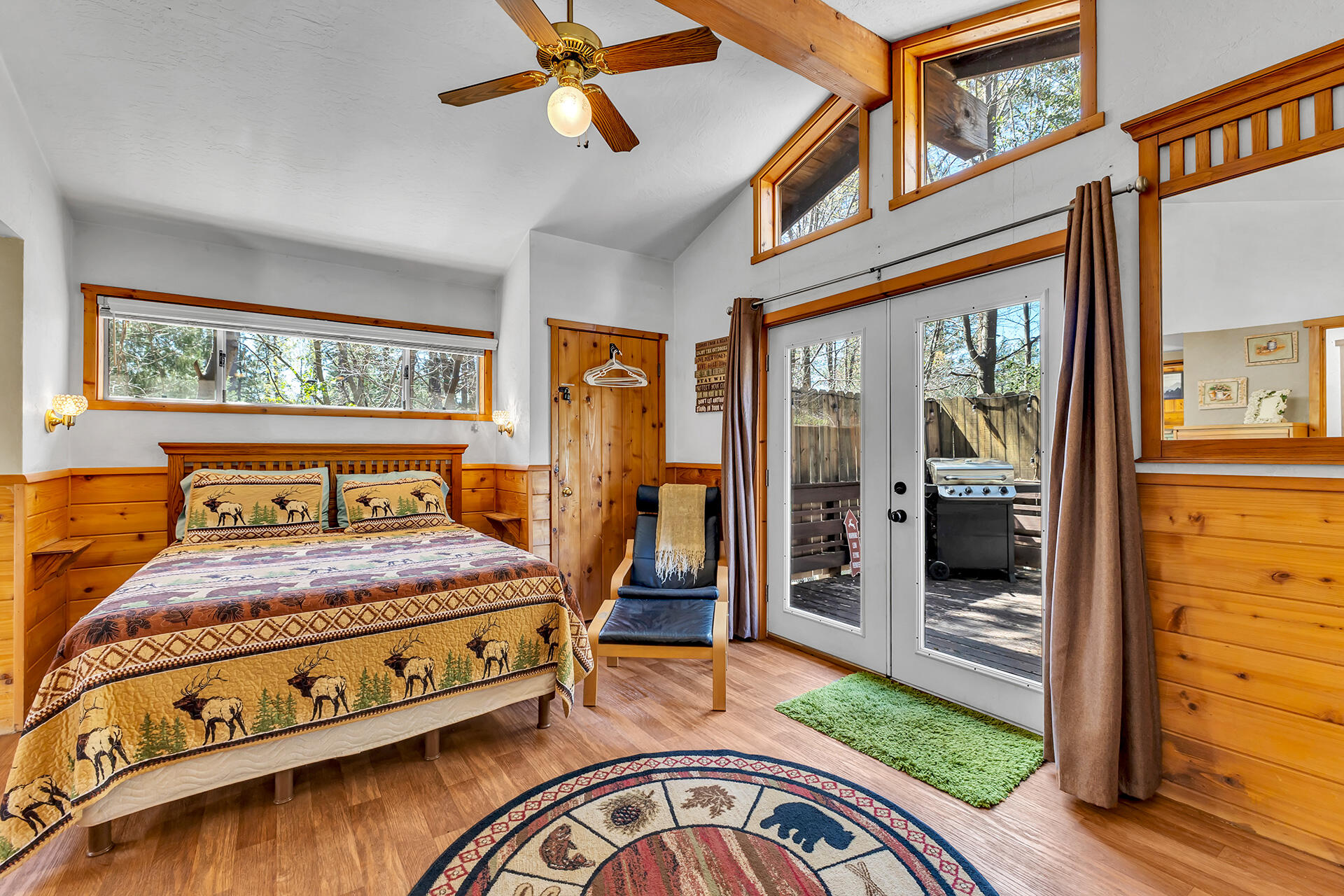 53460 Tollgate Road Idyllwild, CA 92549 - Photo 22 of 37 a bedroom with a bed and wooden floor