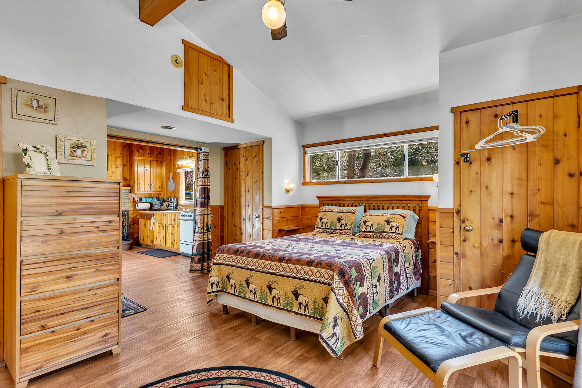 53460 Tollgate Road Idyllwild, CA 92549 - Photo 23 of 37 a bedroom with a bed and wooden floor