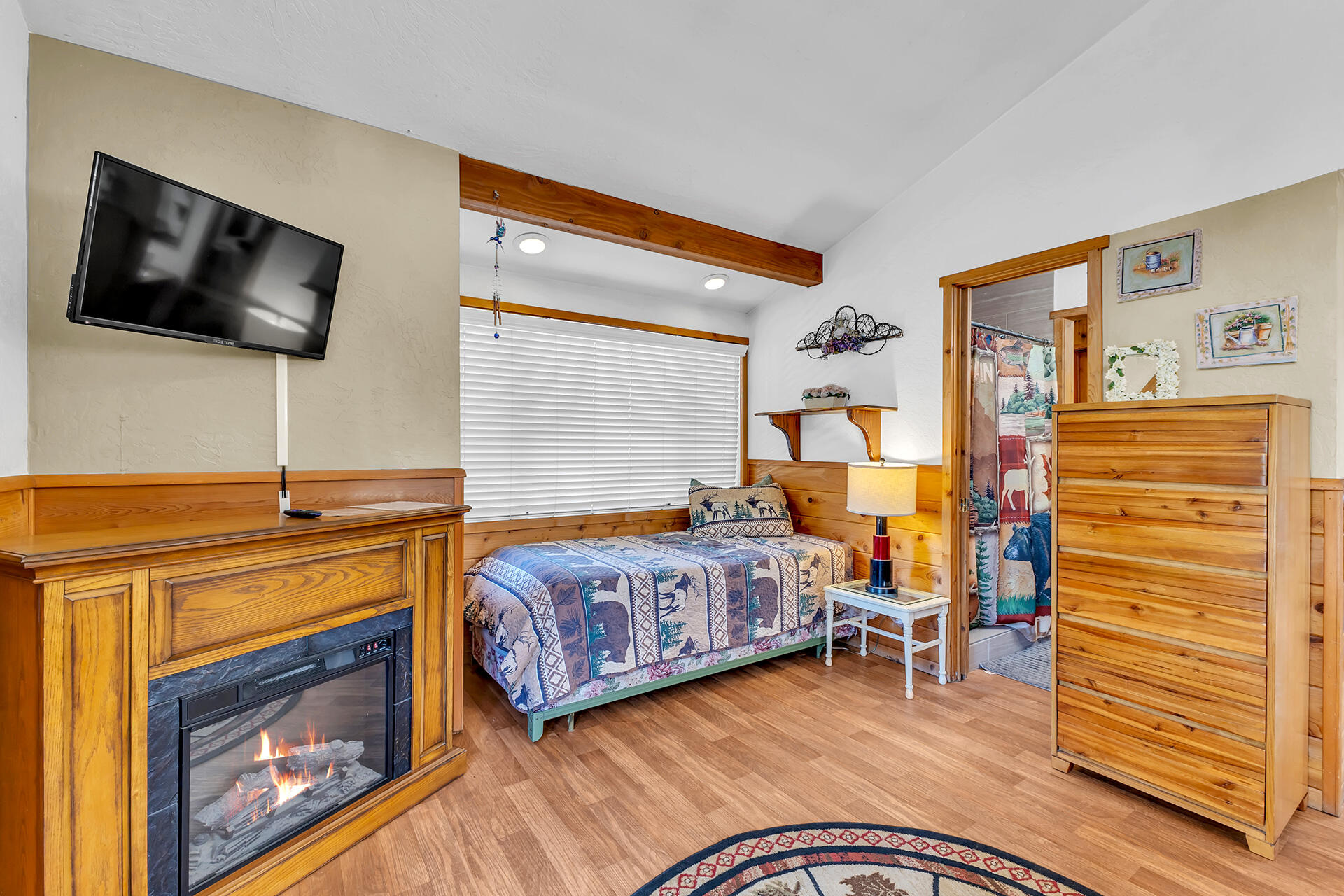 53460 Tollgate Road Idyllwild, CA 92549 - Photo 25 of 37 a bedroom with a bed and flat screen tv