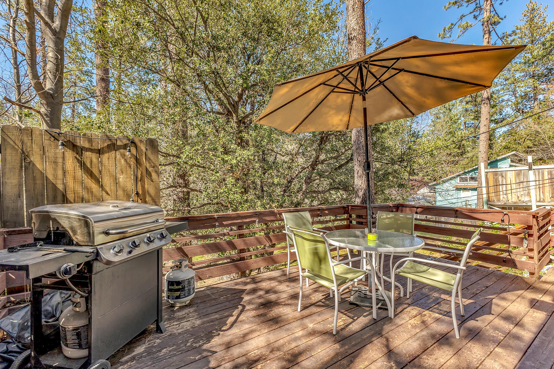 53460 Tollgate Road Idyllwild, CA 92549 - Photo 26 of 37 a view of a patio with table and chairs under an umbrella