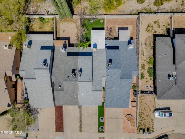 an aerial view of residential houses with outdoor space